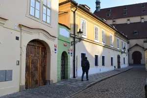 Old Town street with tiny green house near Hastal square