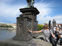 charles bridge touching plaque