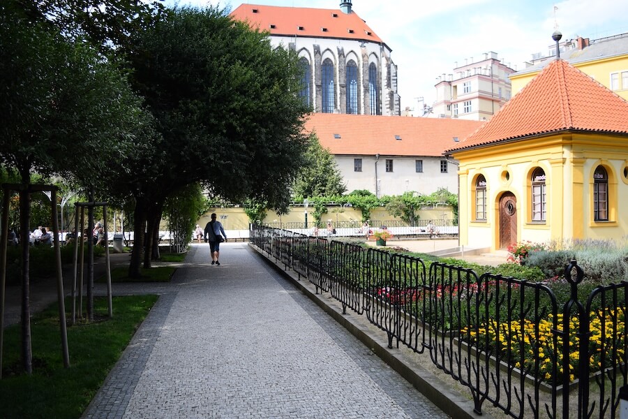 Person walking in Franciscan Garden in Prague Person walking in Franciscan Garden in Prague