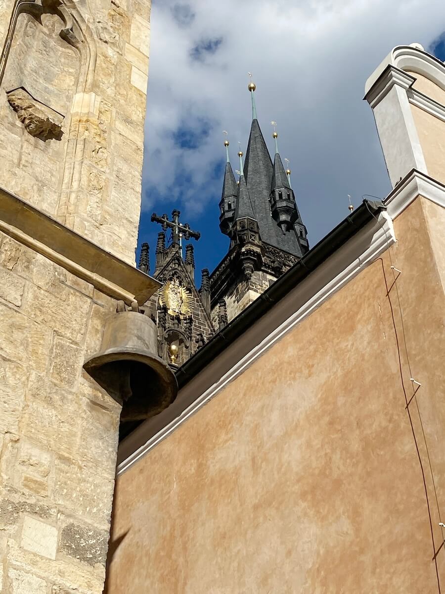 Bell on wall of House at the Stone Bell in Prague