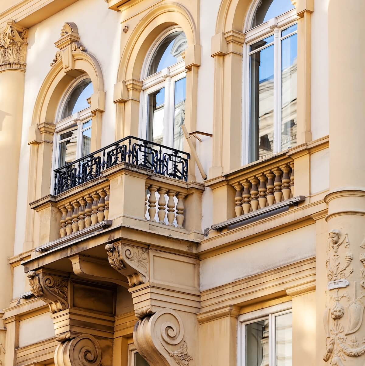 Close up of balcony on yellow building