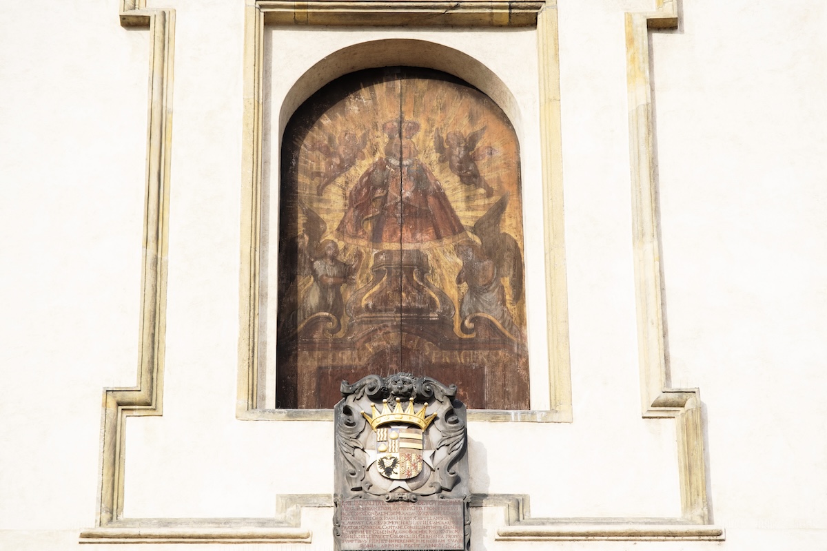 Painting of Infant of Prague on exterior of church in Mala strana Painting of Infant of Prague on exterior of church in Mala strana