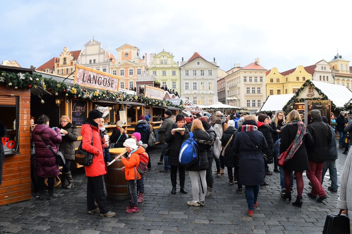people visiting Prague Christmas markets during the day